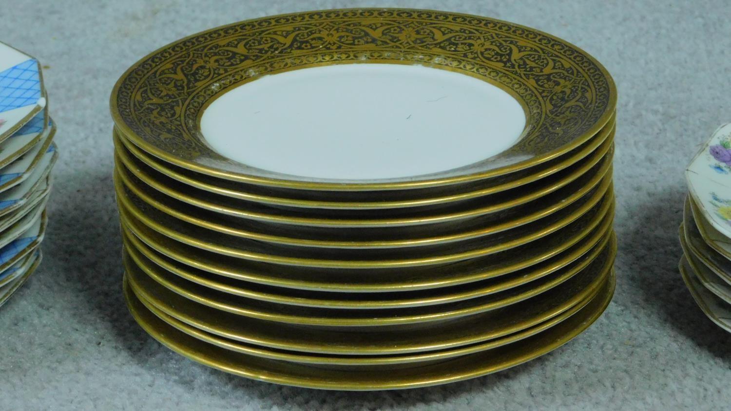 A collection of French hand painted plates with gilded detailing. - Image 7 of 11