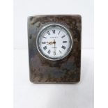 Silver desk clock by Kitney & Co London. White enamel dial with black Roman numerals. Hallmarked