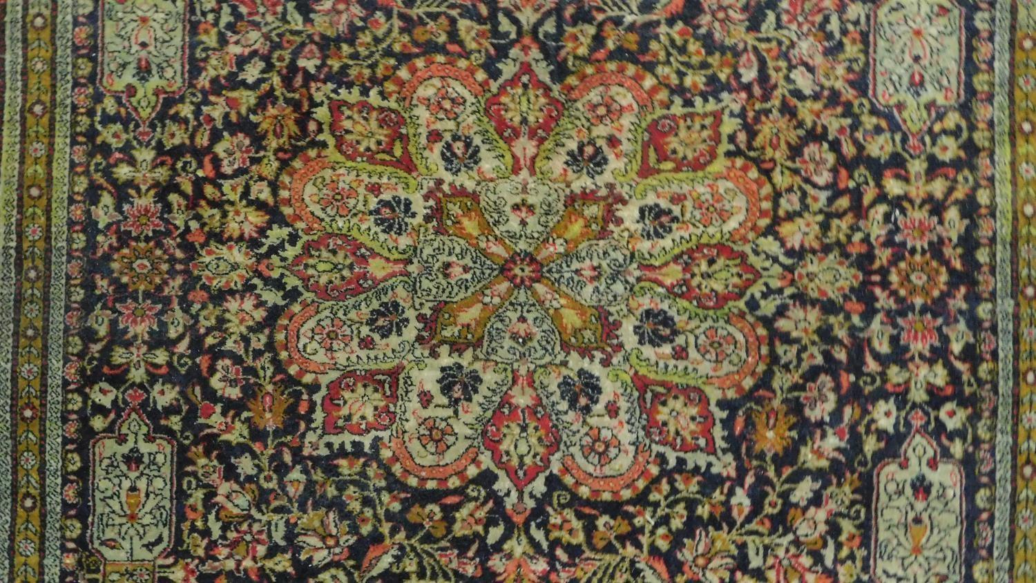 A Persian style rug with central medallion surrounded by floral motifs and a floral and geometric - Image 2 of 5