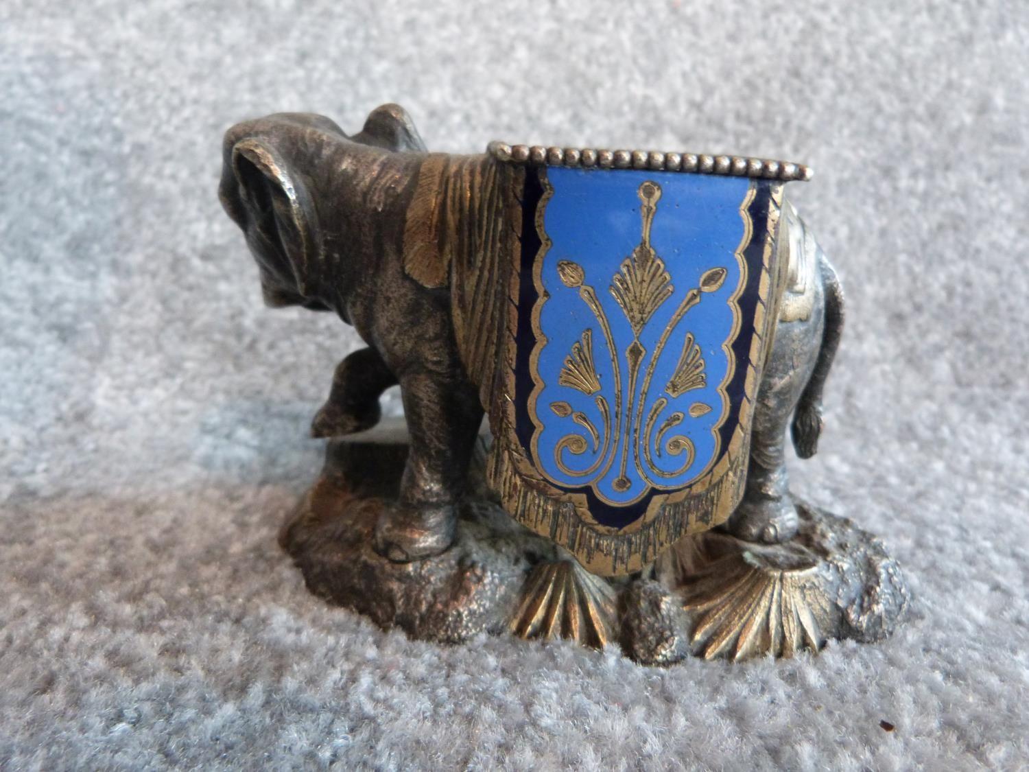 An antique silver plate and blue enamel elephant match holder with gilded details and an Indian - Image 6 of 16