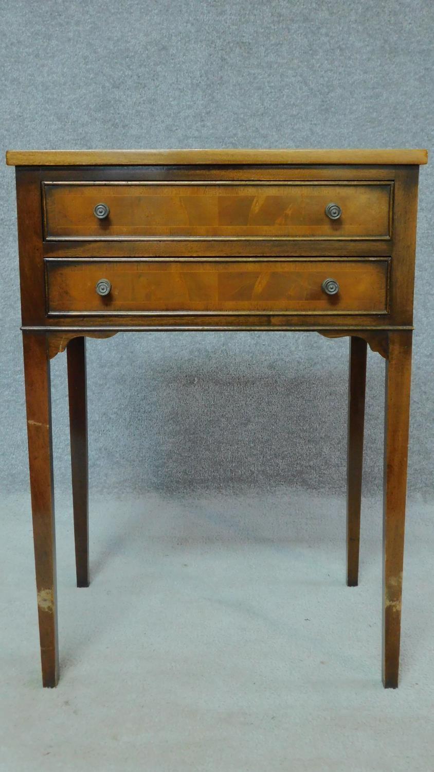 A Georgian style mahogany crossbanded and satinwood strung two drawer side table. H.79 W.53 D.39cm