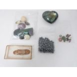 A collection of gemstones and glass stones, including a Labradorite heart, three 0.02 carat round