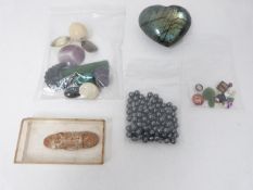 A collection of gemstones and glass stones, including a Labradorite heart, three 0.02 carat round