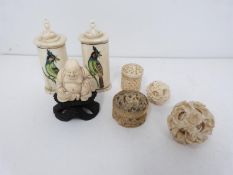 Two bone scent bottles with painted birds, a carved ivory buddah on carved hardwood stand, two