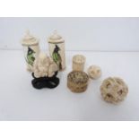 Two bone scent bottles with painted birds, a carved ivory buddah on carved hardwood stand, two