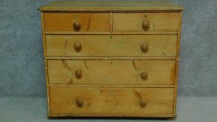 A 19th century pine chest of two short over three long drawers. H.87 W.102 D.53cm