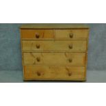 A 19th century pine chest of two short over three long drawers. H.87 W.102 D.53cm