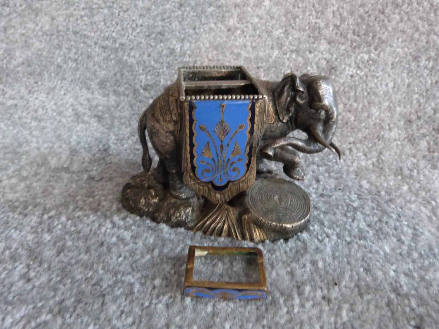 An antique silver plate and blue enamel elephant match holder with gilded details and an Indian - Image 2 of 16