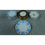 A collection of French hand painted plates with gilded detailing.