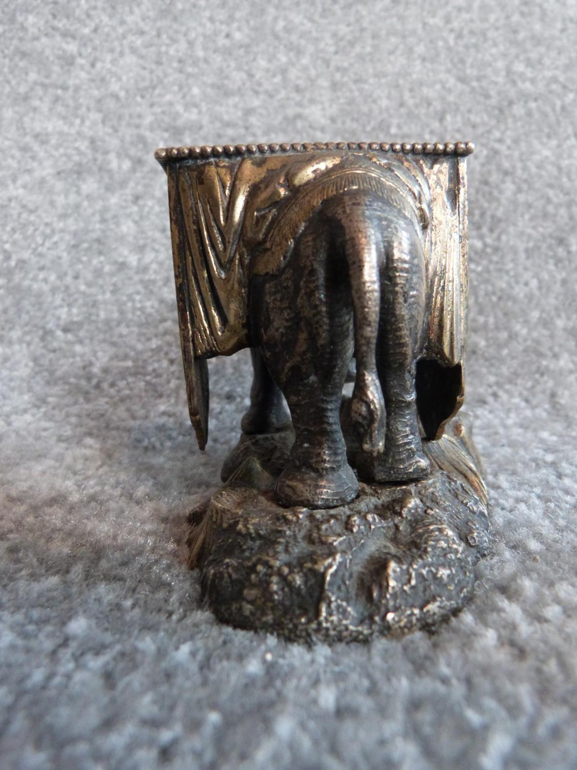 An antique silver plate and blue enamel elephant match holder with gilded details and an Indian - Image 8 of 16