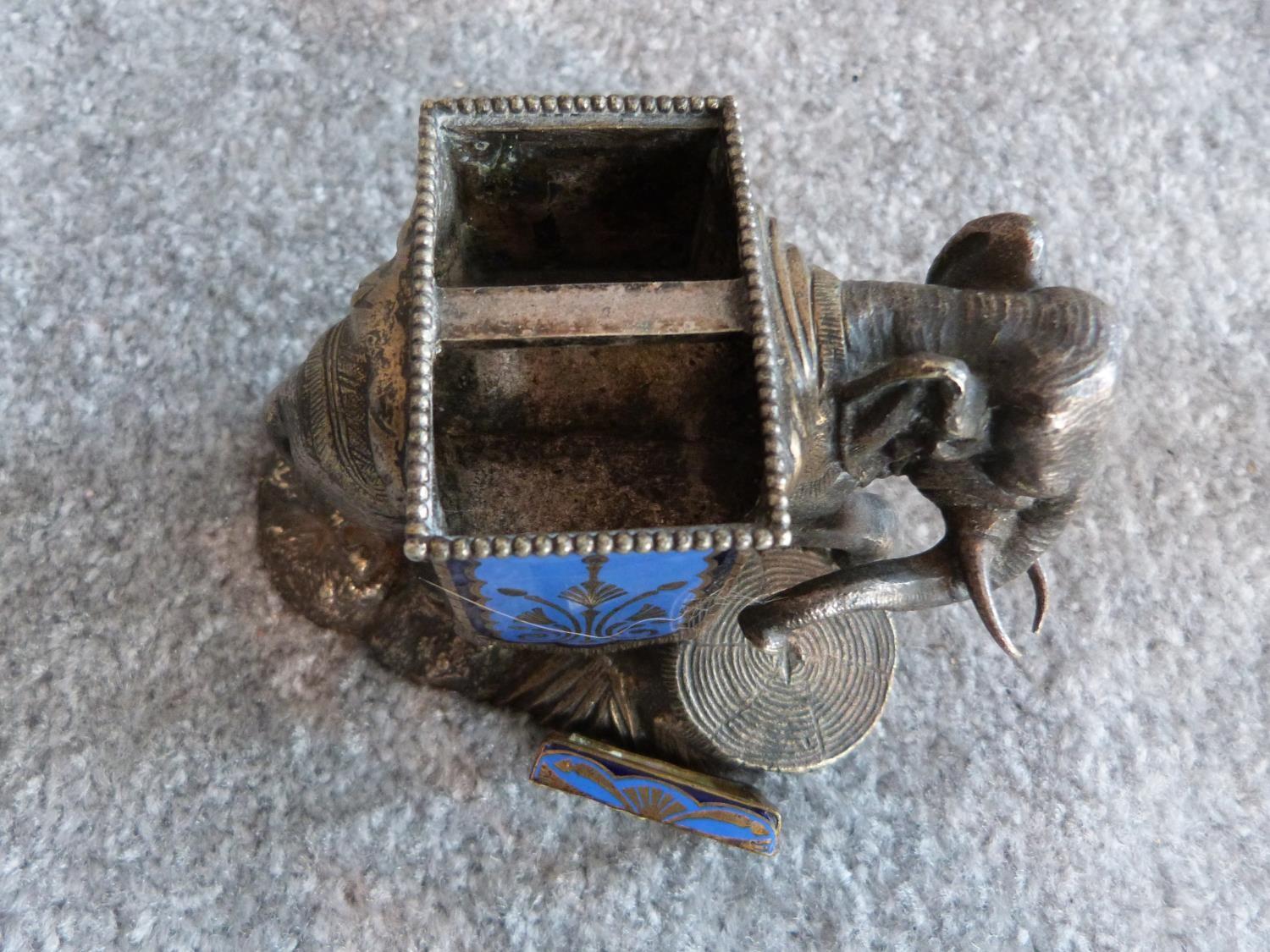 An antique silver plate and blue enamel elephant match holder with gilded details and an Indian - Image 9 of 16