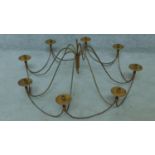 A wrought metal eight branch ceiling candle chandelier. H.44 W.102cm