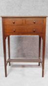An Edwardian mahogany and ebony inlaid small side table fitted drawers on tapering square section
