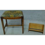 An oak Arts and Crafts book trough, signed by R. G. Collins to the bottom and an oak stool in