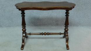 A 19th century mahogany shaped top centre table on stretchered cabriole supports. H.69 W.91 D.45cm