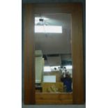 A large contemporary teak framed pier mirror. 200x116cm