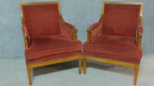A pair Louis XVI style walnut framed armchairs raised on tapering reeded turned supports. H.89cm
