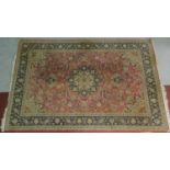 A Persian Tafresh style rug, central double pendant medallion with repeating geometric motifs on a