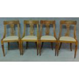 A set of four 19th century Continental walnut and satinwood inlaid chairs, lyre shaped backs on