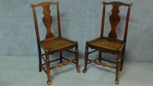 A pair of 19th century country elm dining chairs raised on stretchered turned supports. H.92cm