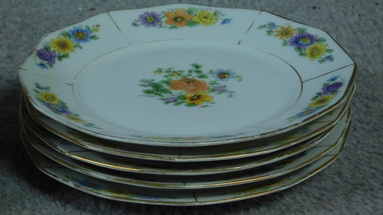 A collection of French hand painted plates with gilded detailing. - Image 8 of 11