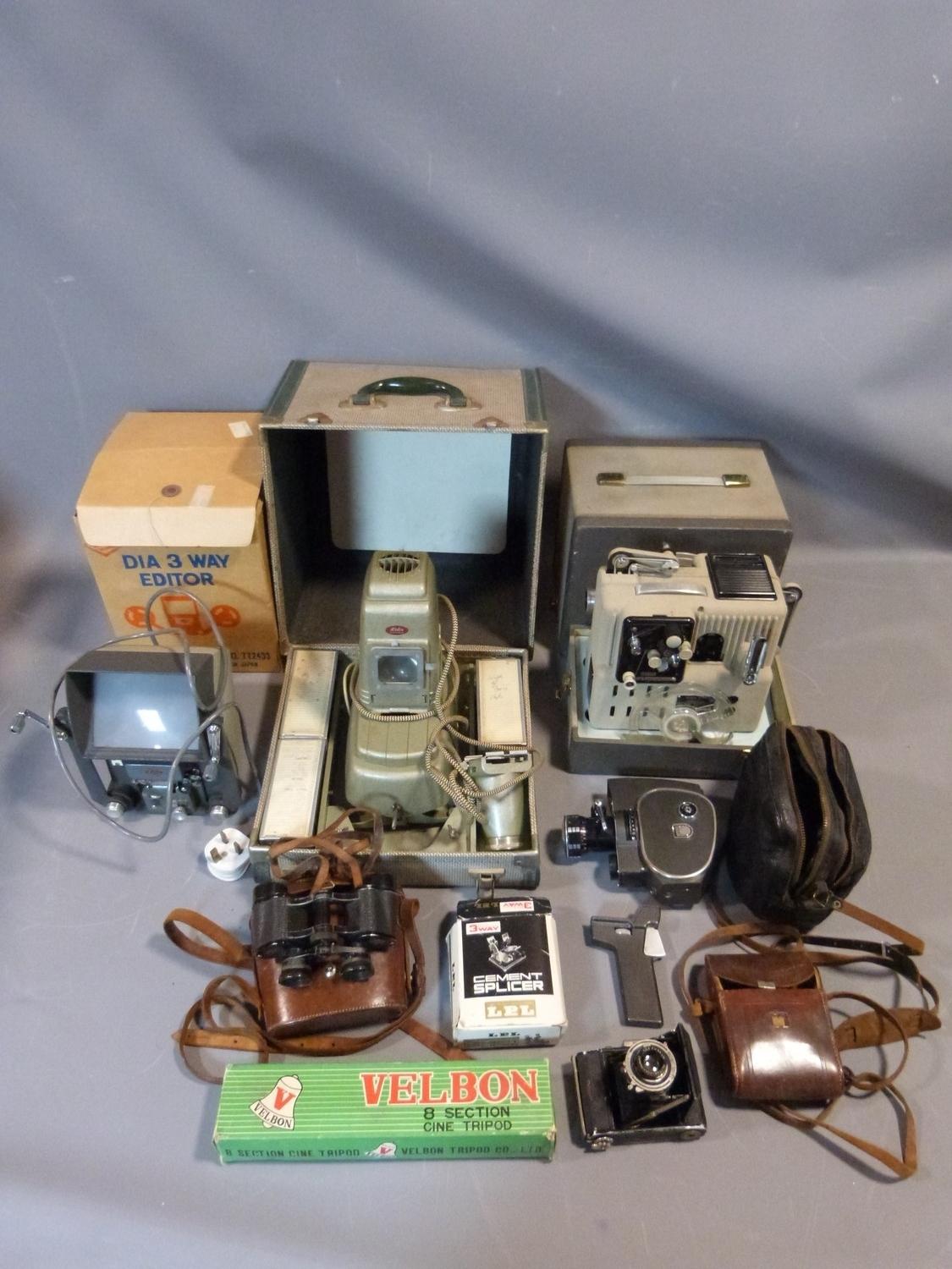 A collection of cameras and cinematic equipment including a Zeiss Ikon camera in leather case, Aldis