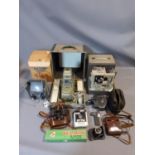 A collection of cameras and cinematic equipment including a Zeiss Ikon camera in leather case, Aldis