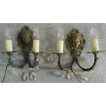 A pair of brass wall lights with crystal drops and Art Noveau style masks to back. H.30 W.26cm