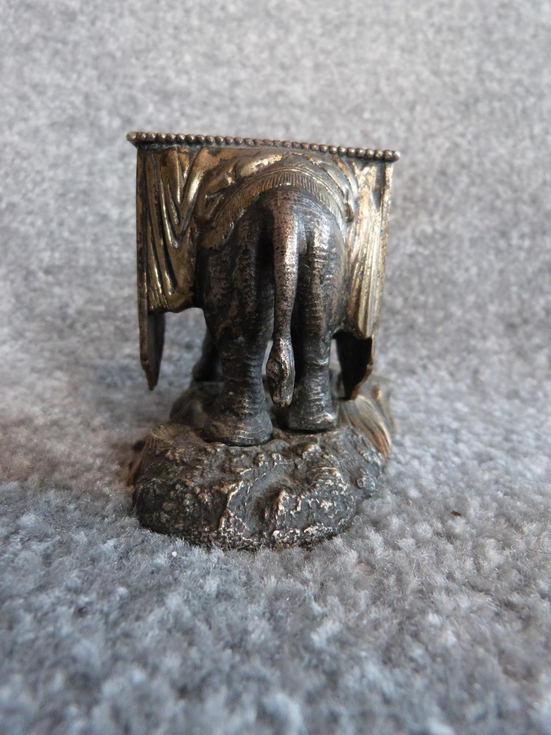 An antique silver plate and blue enamel elephant match holder with gilded details and an Indian - Image 7 of 16