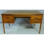A mid 20th century oak pedestal desk. H.76 W.138 D.77cm