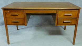 A mid 20th century oak pedestal desk. H.76 W.138 D.77cm