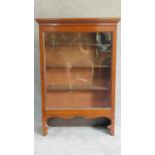 A 19th century mahogany glazed single door bookcase on shaped bracket feet. H.123 W.82 D.28cm