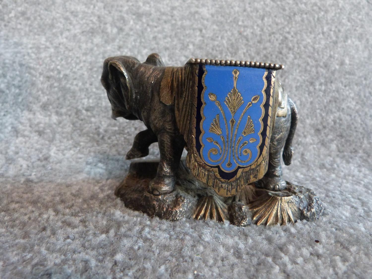 An antique silver plate and blue enamel elephant match holder with gilded details and an Indian - Image 5 of 16
