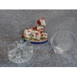 A trio of a Staffordshire style figurine of female dog and puppy on green grass, handpainted , a