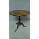 A Georgian oak circular tilt top table raised on cabriole tripod base. H.68 W.73 D.73cm