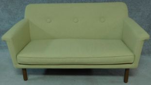 A 1960's retro style pale sage sofa, by Orla Kiely. H.83 W.144 D.72cm