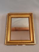 A 19th century giltwood and gesso rectangular wall mirror. 51x42cm
