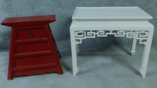 A red lacquered Chinese chest of tapering form and a Chinese coffee table. H.51 W.60 D.40cm (