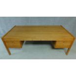 A large vintage teak pedestal desk. H.72 W.200 D.100cm