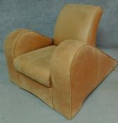 An Art Deco style pale tan leather fastback design armchair H.80cm