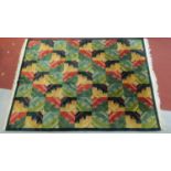 A large abstract design rug with a repeating tile pattern, fringed 310x225cm