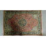 A Persian Sarouk Style rug, the central double pendant medallion with repeating petal motifs, on
