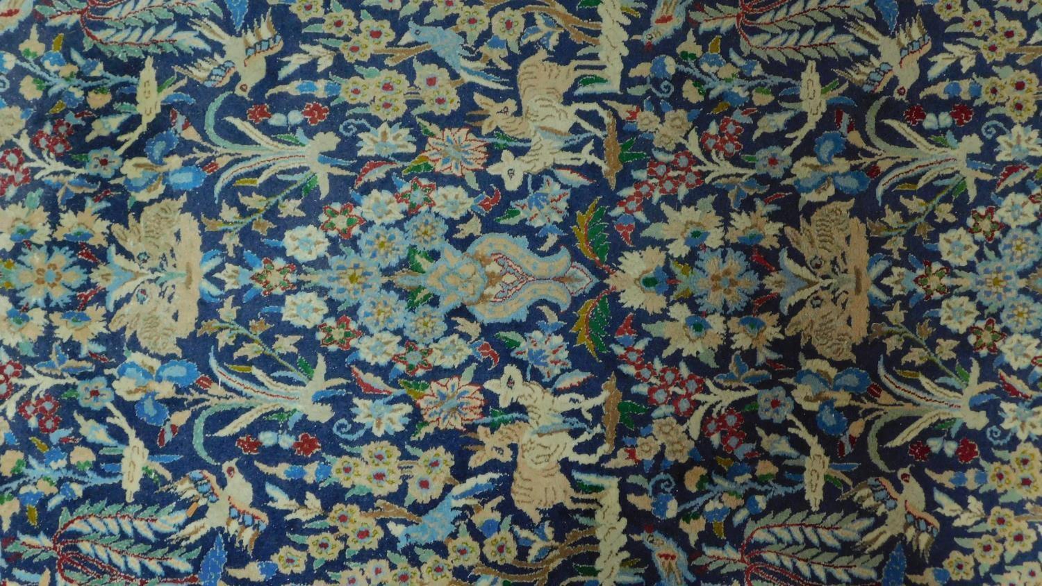 A floral runner depicting a wildlife scene on a midnight blue field within corresponding borders - Image 2 of 4