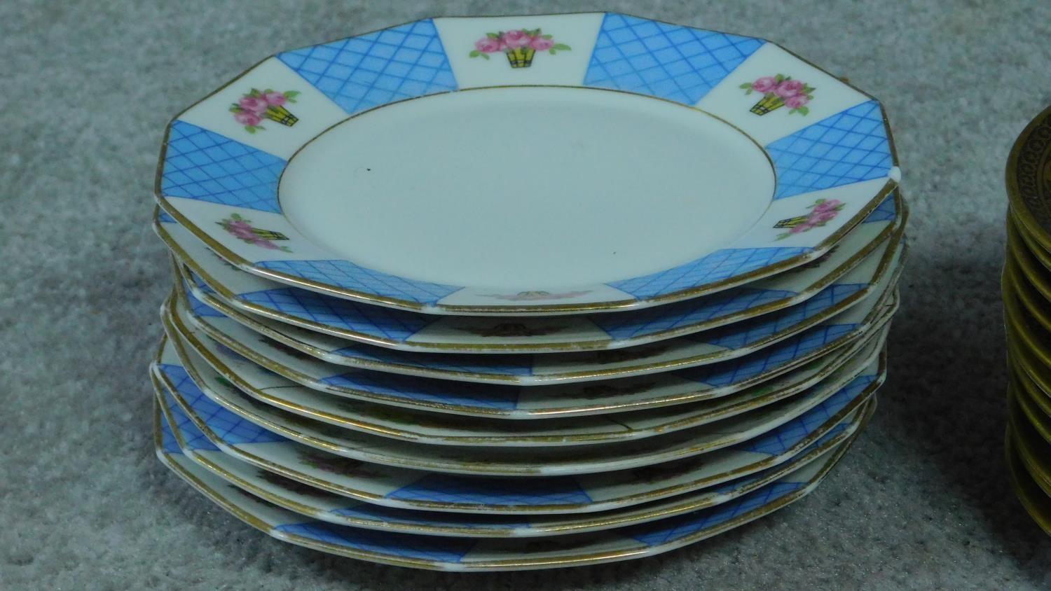 A collection of French hand painted plates with gilded detailing. - Image 6 of 11