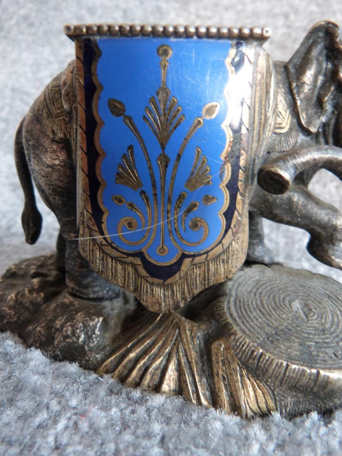 An antique silver plate and blue enamel elephant match holder with gilded details and an Indian - Image 3 of 16