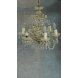 A gilt metal and crystal six branch ceiling chandelier. H.50 W.50cm