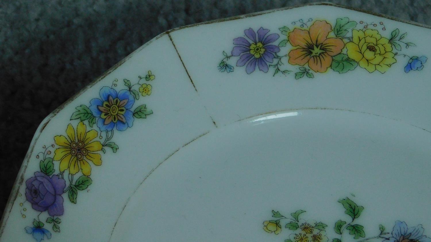 A collection of French hand painted plates with gilded detailing. - Image 5 of 11