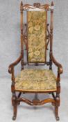 A Victorian rosewood armchair in the Carolean style in its original tapestry upholstery. H.129cm