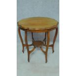 A late Victorian shaped top occasional table on six cabriole supports united by undertier. H.73 W.75