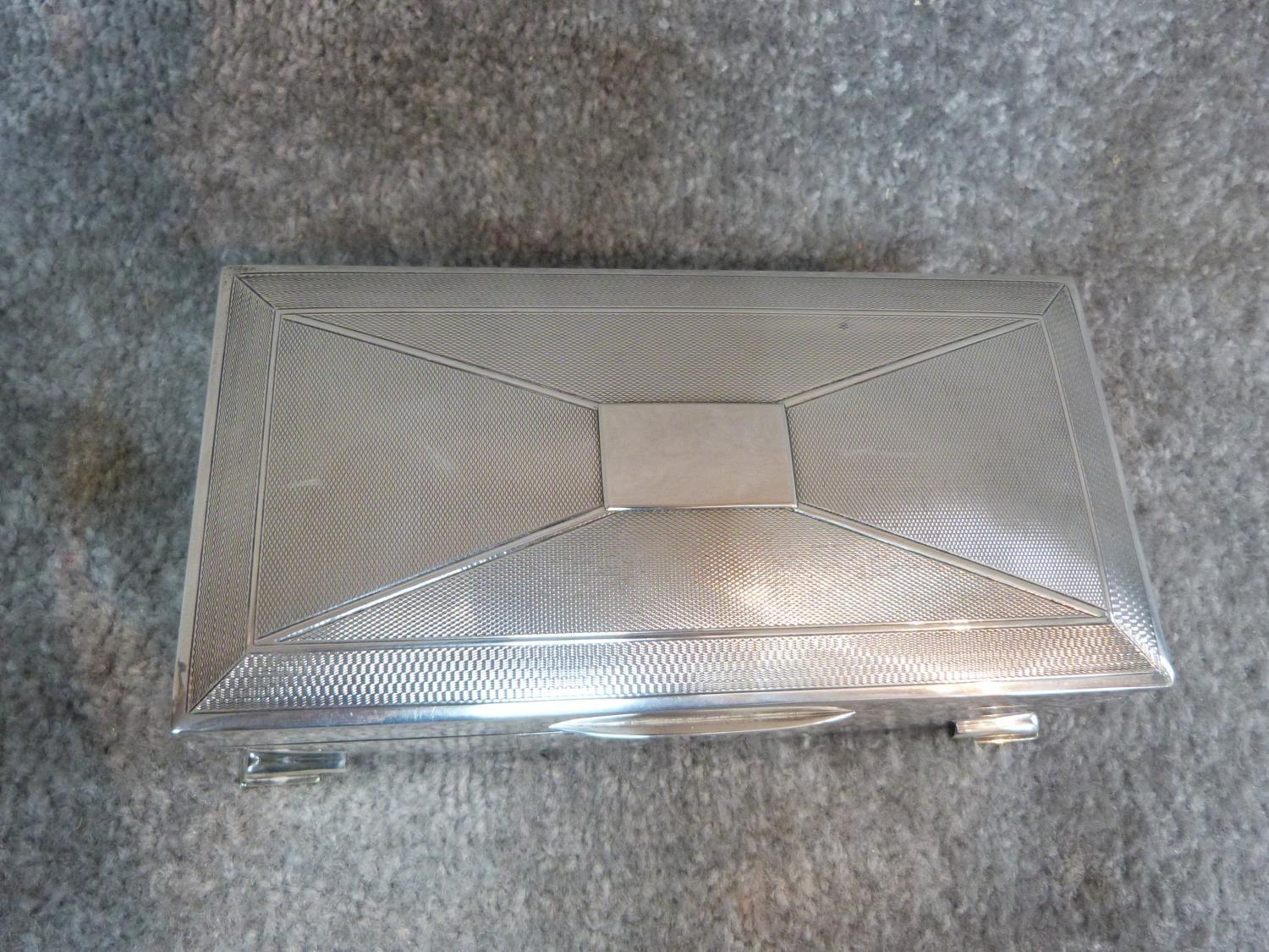 A silver cigarette box with engine turned decoration and two plain rectangular cartouches. - Image 2 of 9